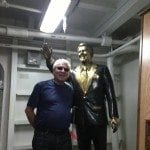 Image showing Lou Fioritto posing next to the Ronald Reagan statue on the USS Reagan in 2012