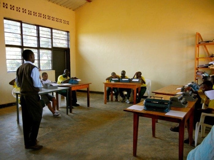 Image showing Eric Niyikiza teaching a class at the HVP Gatagara School for the Visually Impaired.