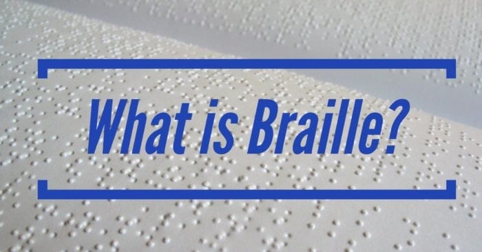 The words "What is Braille?" displayed over a Braille document. The words "What is Braille?" displayed over a Braille document.