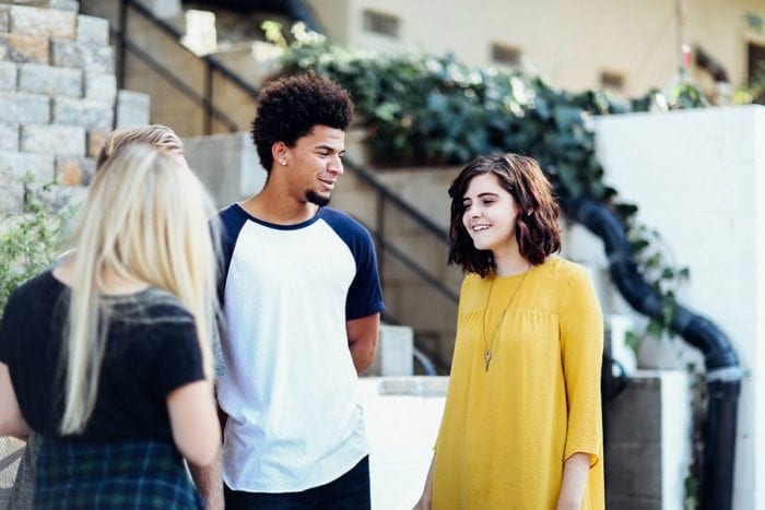 Three people talking to each other. Three people talking to each other.